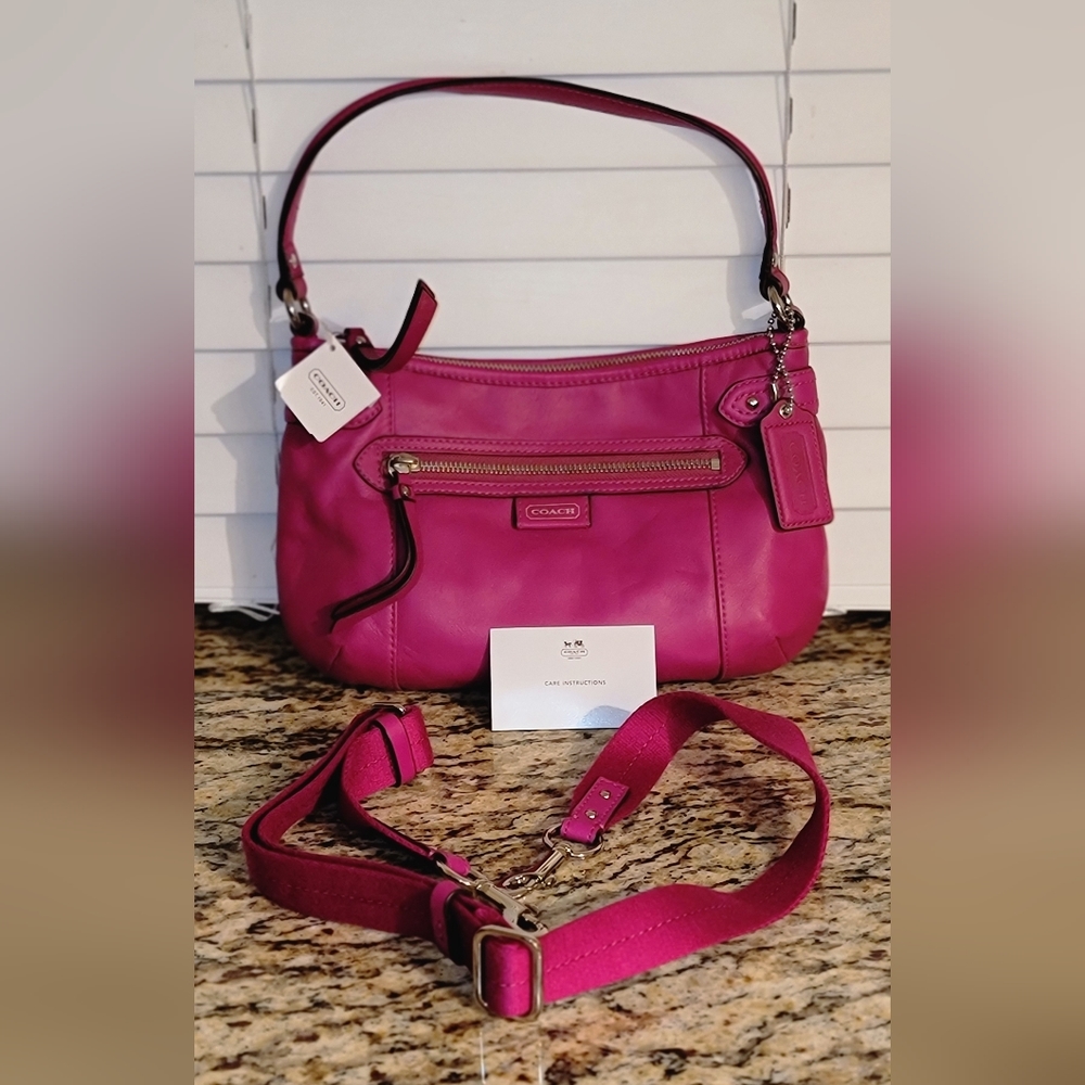 Pink Coach leather purse NWT has removable cloth strap.